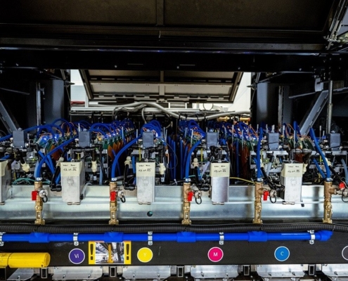 Visitors get a close-up view inside the Delta SPC 130 press in Lienz